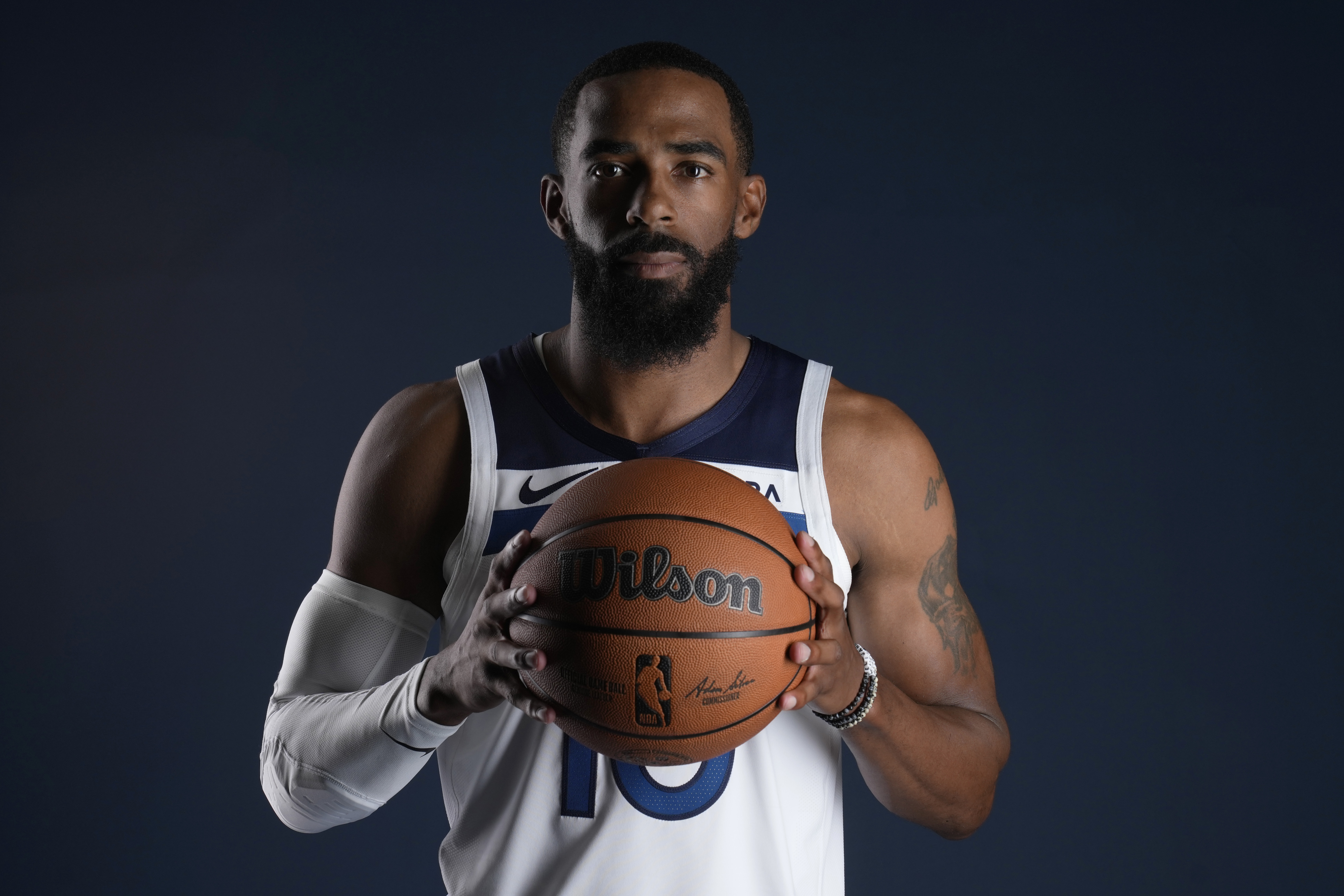 Minnesota Timberwolves guard Mike Conley (10) poses for a photo during the NBA basketball team's media day, Thursday, Sept. 28, 2023, in Minneapolis.