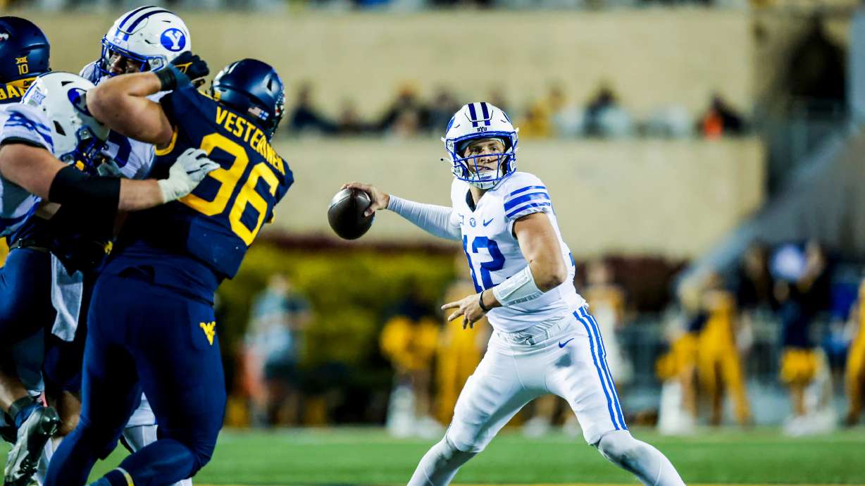 BYU quarterback Jake Retzlaff throws downfield during a game against West Virginia, Saturday, Nov. 4, 2023, in Morgantown, W. Va. BYU lost, 37-7.