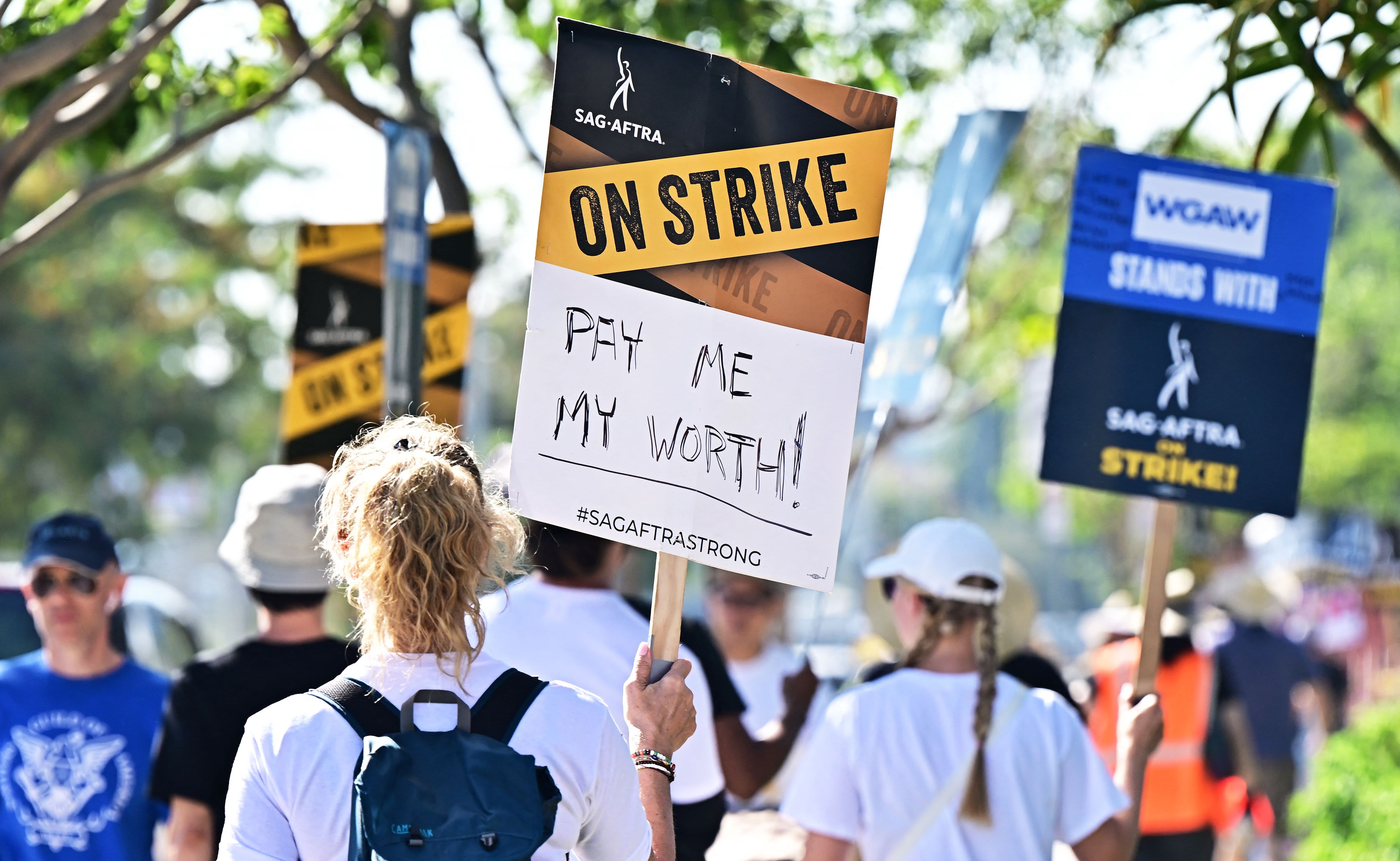 SAG-AFTRA members picket outside of Netflix's building in this undated photo. A deal to resolve film and television actors’ 113-day strike could be imminent.