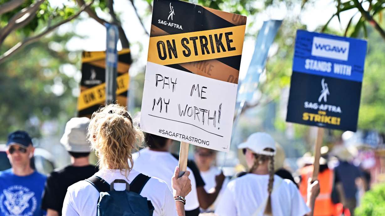SAG-AFTRA members picket outside of Netflix's building in this undated photo. A deal to resolve film and television actors’ 113-day strike could be imminent.