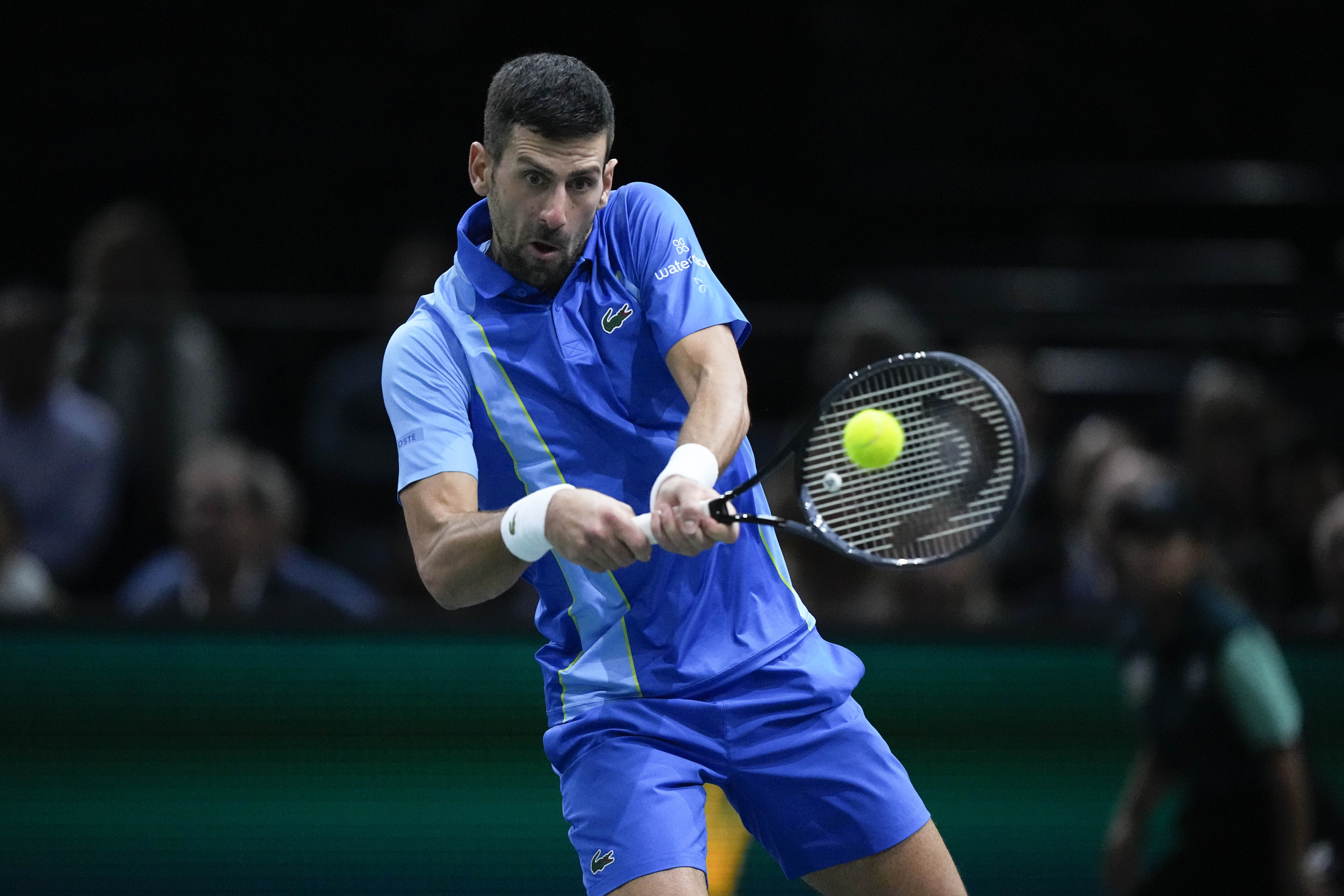 Serbia's Novak Djokovic returns the ball to Bulgaria's Grigor Dimitrov during the final match of the Paris Masters tennis tournament at the Accor Arena, in Paris, Sunday, Nov. 5, 2023.