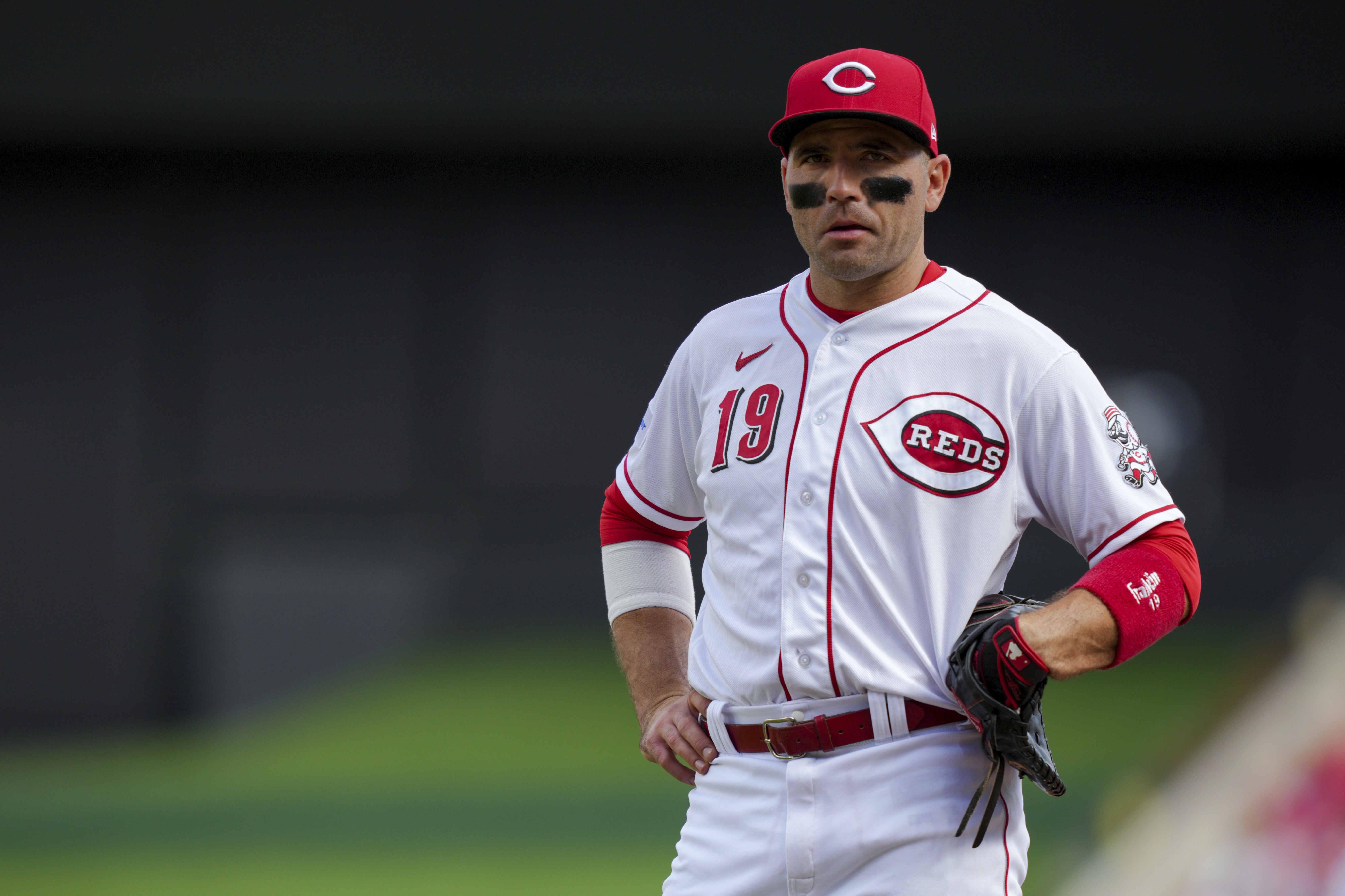 FILE - Cincinnati Reds' Joey Votto stands on the field during a baseball game against the Pittsburgh Pirates in Cincinnati, Sunday, Sept. 24, 2023. Votto's $20 million option for 2024 was declined Saturday, Nov. 4, 2023, by the Reds, making the first baseman a free agent and possibly ending his career with Cincinnati after 17 seasons. Votto will get a $7 million buyout, completing a contract that guaranteed $251.5 million over 12 seasons. 