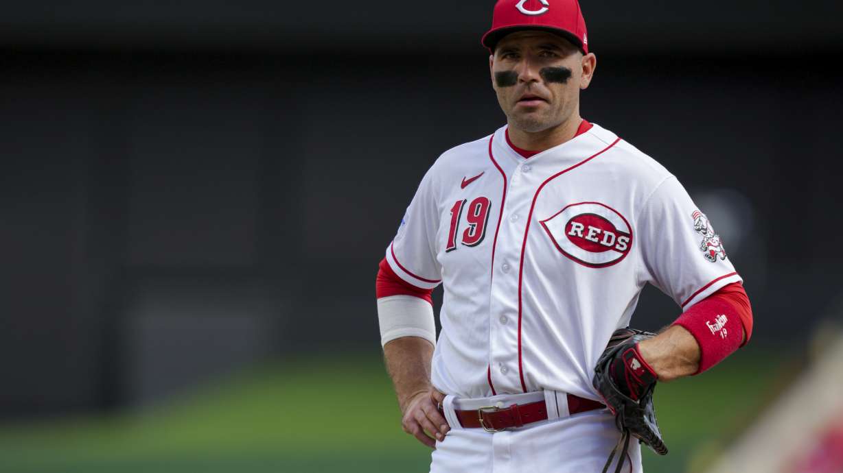FILE - Cincinnati Reds' Joey Votto stands on the field during a baseball game against the Pittsburgh Pirates in Cincinnati, Sunday, Sept. 24, 2023. Votto's $20 million option for 2024 was declined Saturday, Nov. 4, 2023, by the Reds, making the first baseman a free agent and possibly ending his career with Cincinnati after 17 seasons. Votto will get a $7 million buyout, completing a contract that guaranteed $251.5 million over 12 seasons.