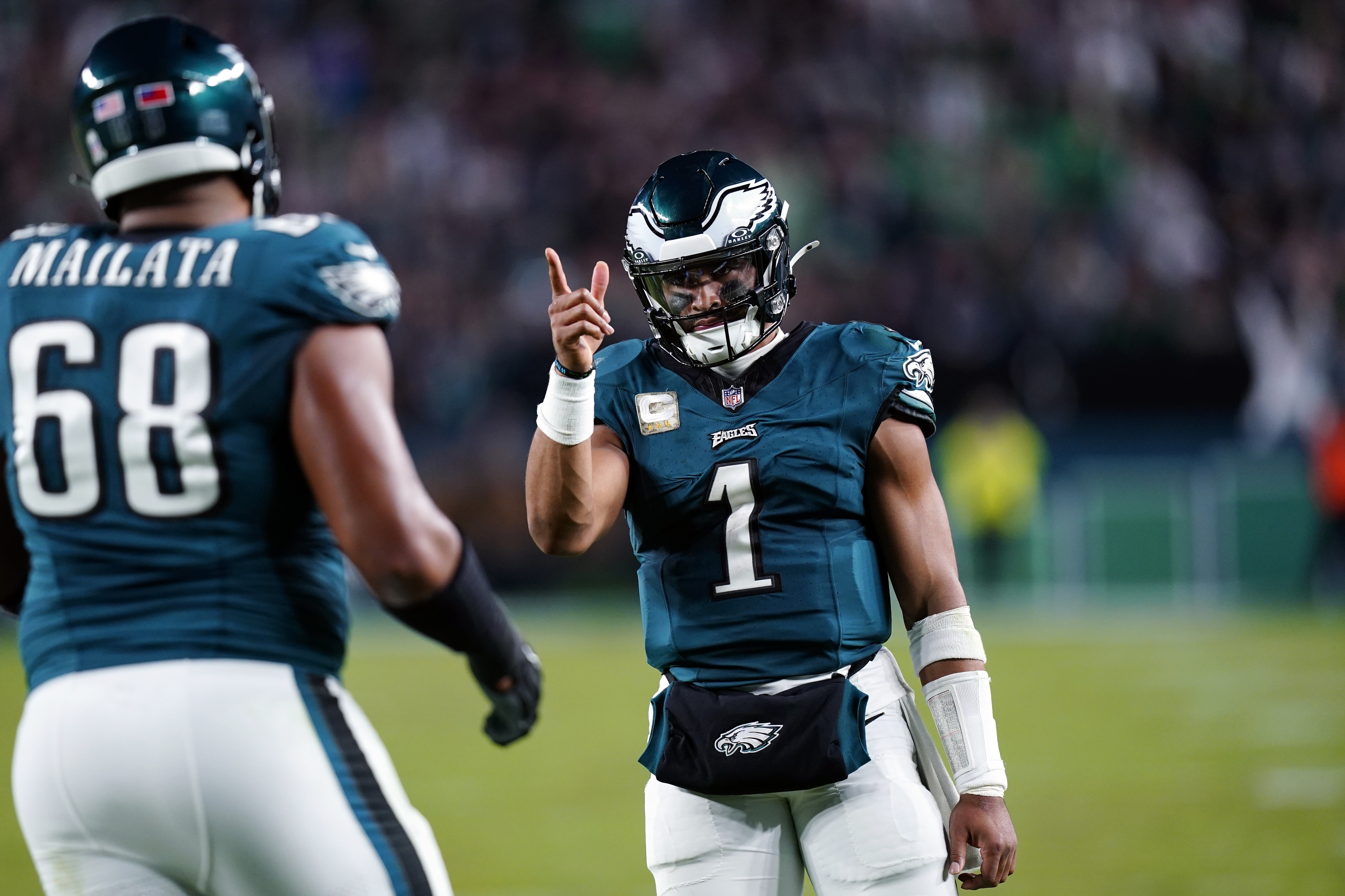 Philadelphia Eagles quarterback Jalen Hurts (1) reacts to his touchdown pass to Eagles' A.J. Brown (11) during the second half of an NFL football game against the Dallas Cowboys on Sunday, Nov. 5, 2023, in Philadelphia.