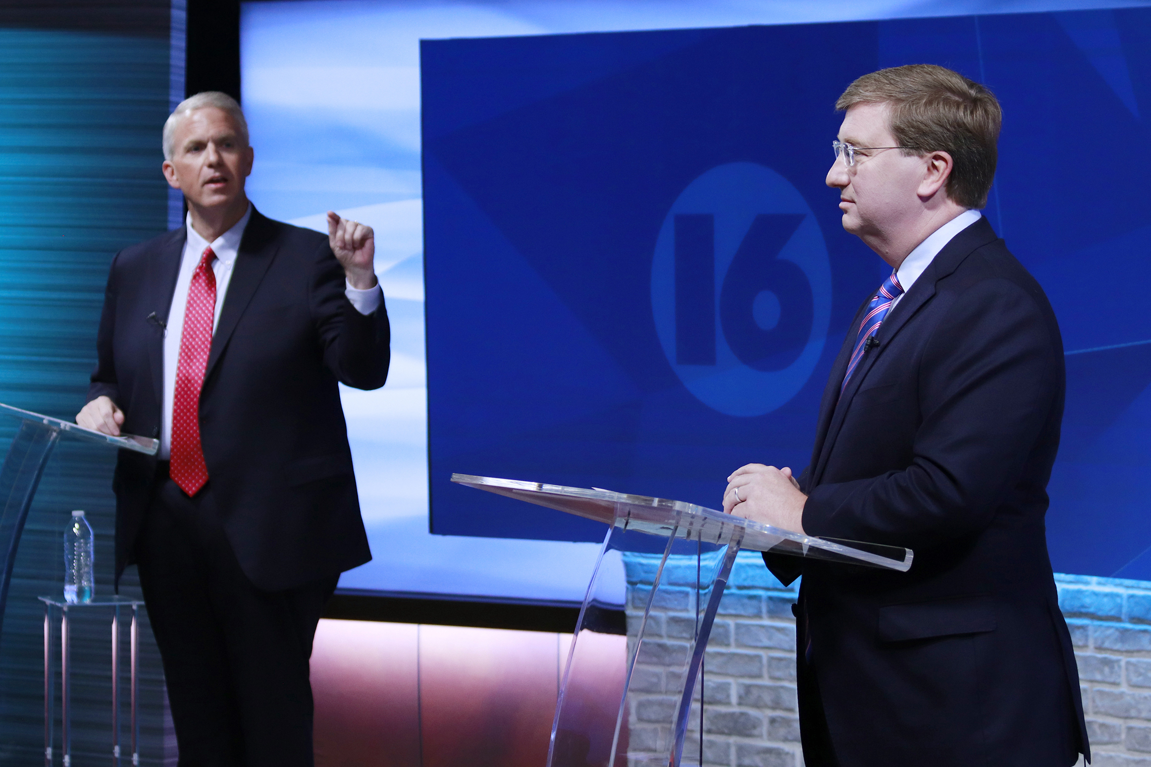 Brandon Presley, the Democratic nominee for governor, left, debates with Republican Mississippi Gov. Tate Reeves during a televised gubernatorial debate Nov. 1, in Jackson, Miss.