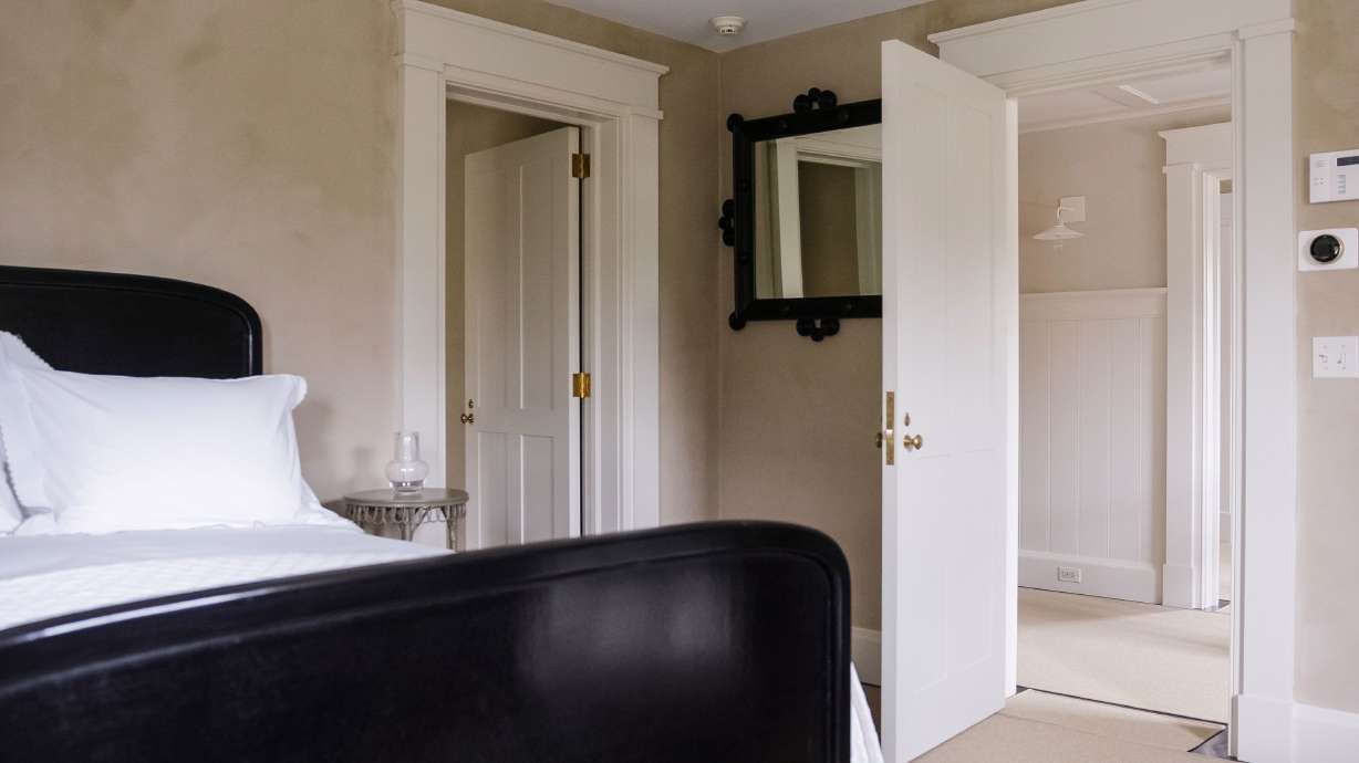 This is one of the simple but stylish bedrooms at Martha Stewart's Tenant House, where neutral colors and clean lines dominate.