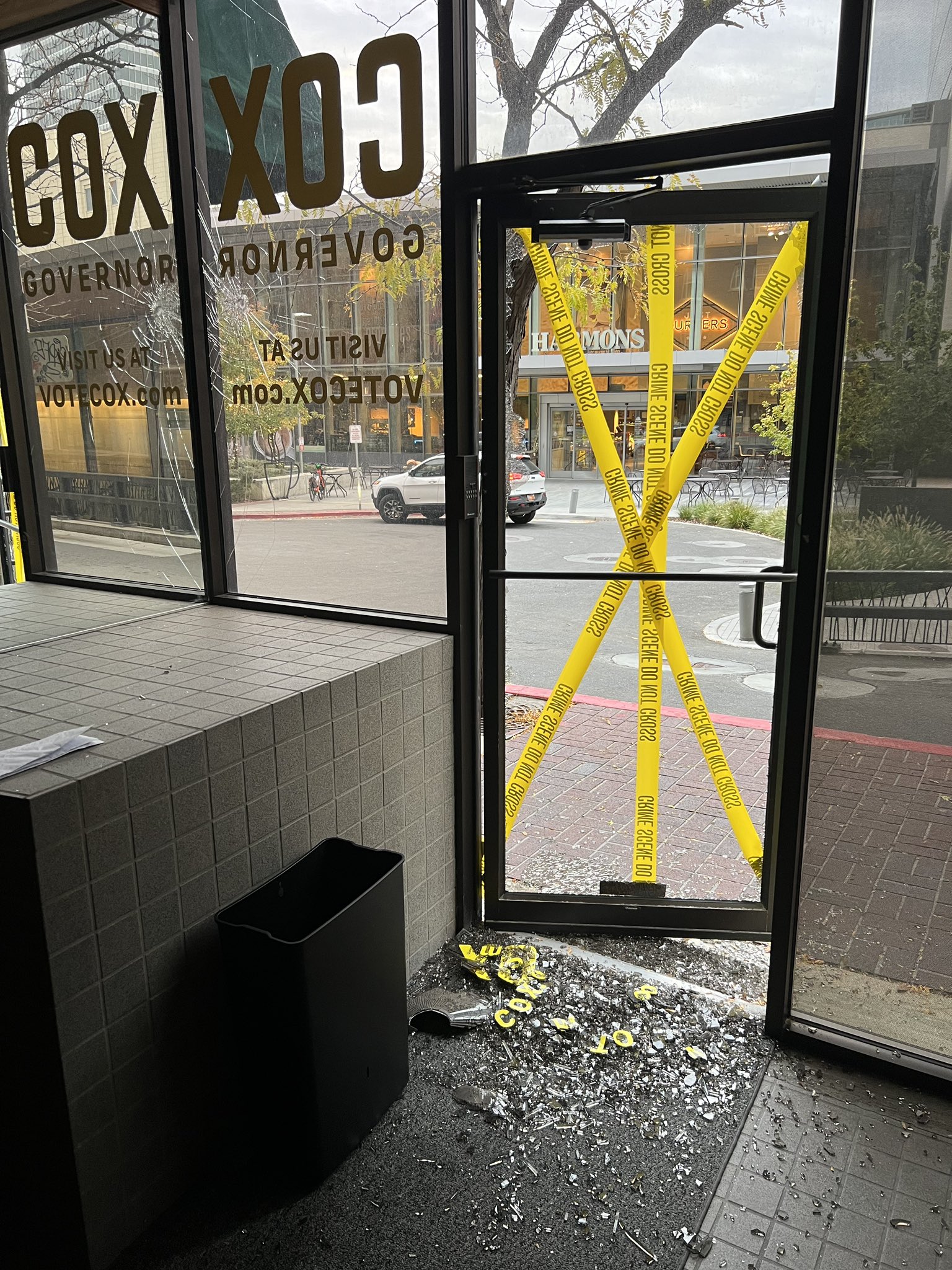 Police tape is seen Monday after Gov. Spencer Cox's campaign headquarters in Salt Lake City was vandalized.