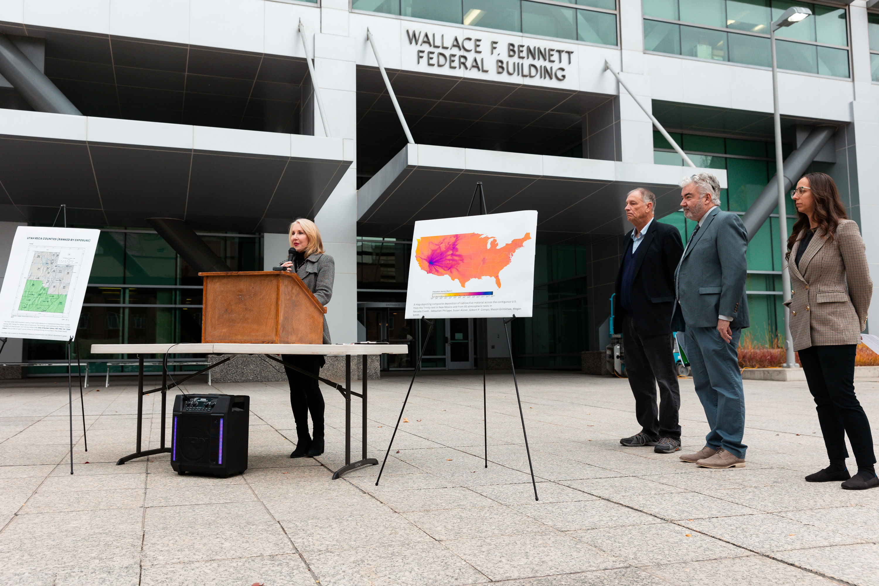 Mary Dickson, a playwright, former journalist and downwinder, shares her experience Monday at the Wallace F. Bennett Federal Building in Salt Lake City. She's part of a group asking for federal help for fallout victims.