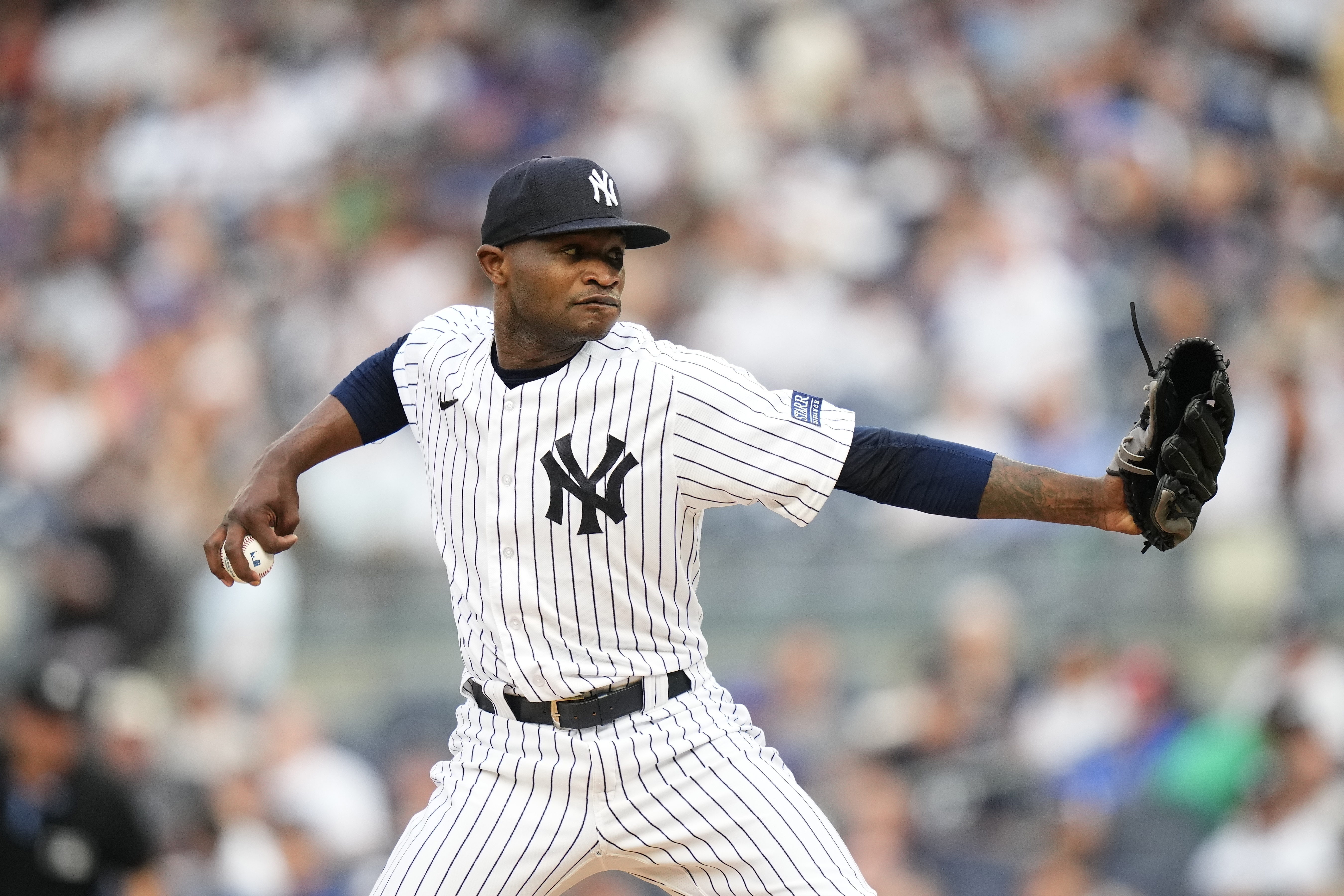 FILE - New York Yankees' Domingo German pitches during the first inning of a baseball game against the New York Mets Tuesday, July 25, 2023, in New York. Domingo Germán became a free agent Monday, Nov. 6, when he refused an outright assignment to the minor leagues from the New York Yankees, five months after he pitched Major League Baseball's 24th perfect game and three months after he entered alcohol abuse treatment.