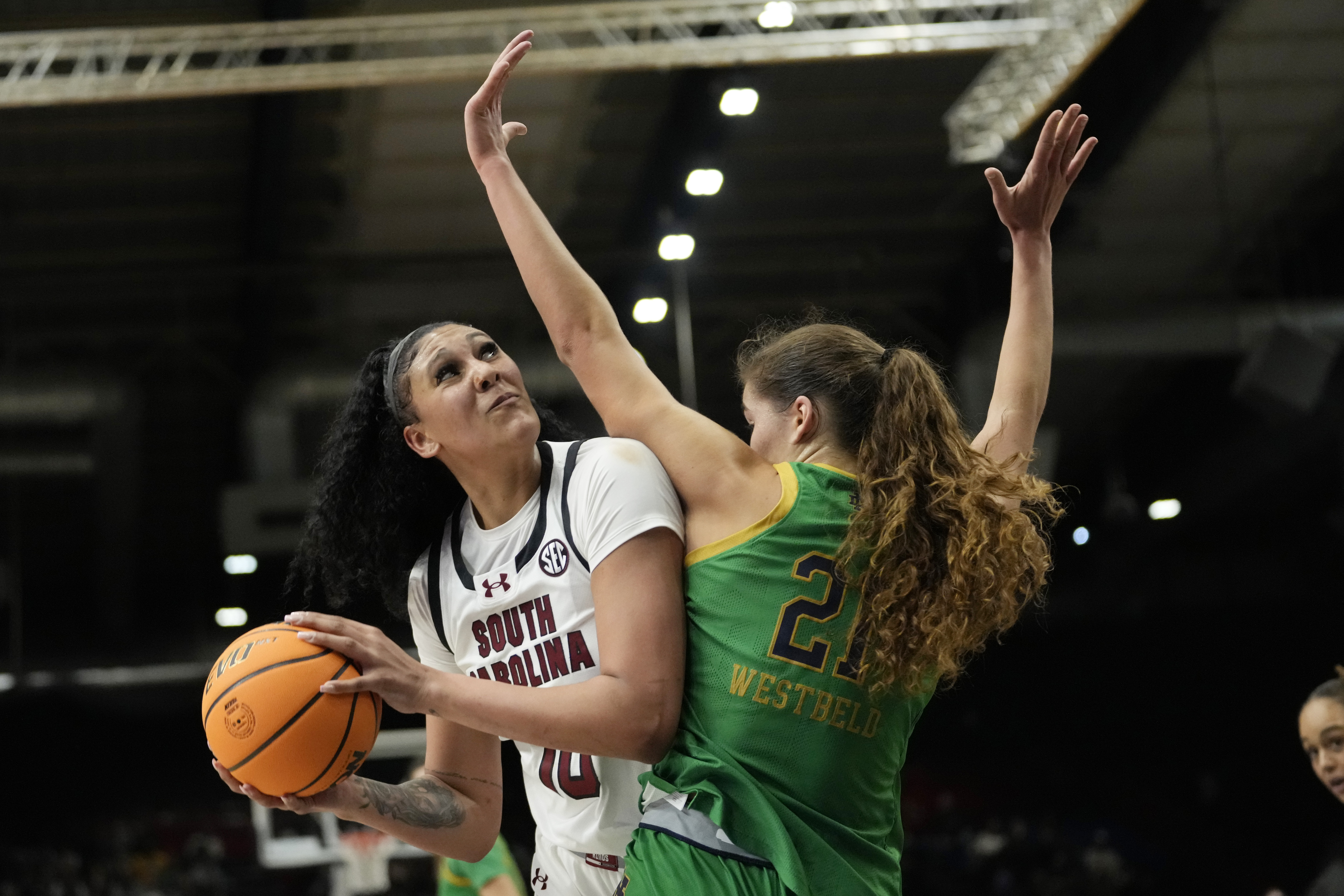 South Carolina center Kamilla Cardoso (10) is defended by Notre Dame forward Maddy Westbeld (21) during the first half of an NCAA college basketball game Monday, Nov. 6, 2023, in Paris. Cardoso had 20 points, 15 rebounds and four blocks as No. 6 South Carolina opened in style with a 100-71 victory over No. 10 Notre Dame in the NCAA's first-ever game in Paris. 