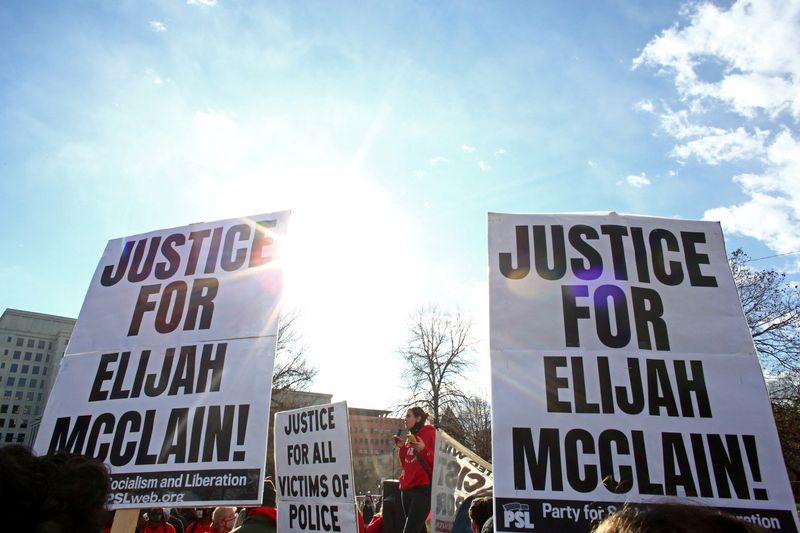 Protesters gather for a rally to call for justice for Elijah McClain in Denver, Nov. 21, 2020. A Colorado jury found police officer Nathan Woodyard not guilty of manslaughter in the 2019 killing of McClain.