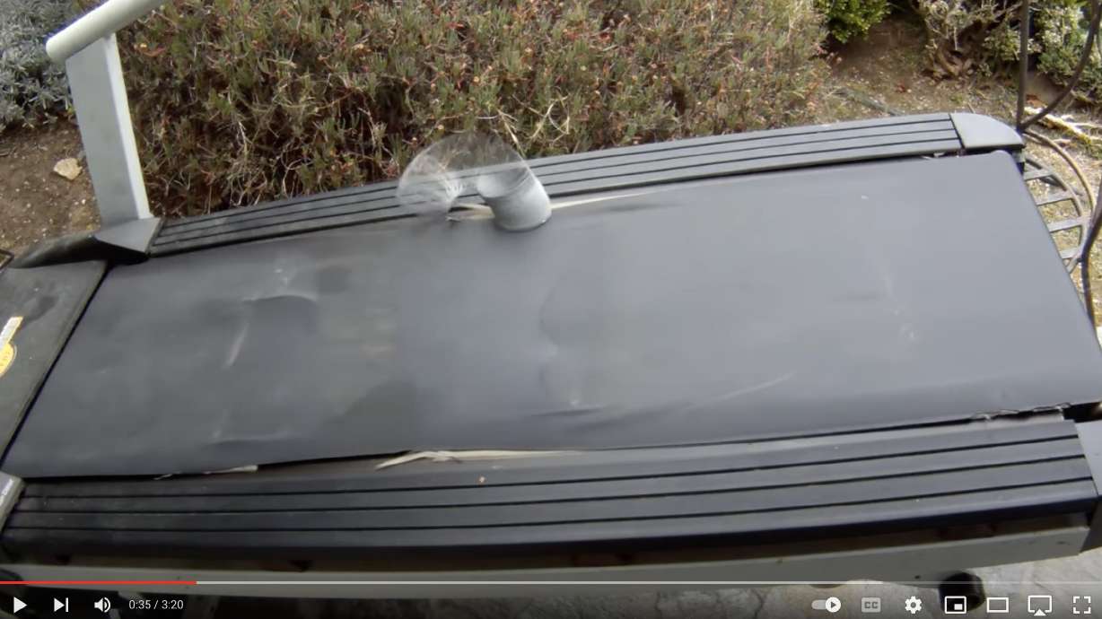 This slinky keeps going on a tilted treadmill for minutes in this YouTube video.