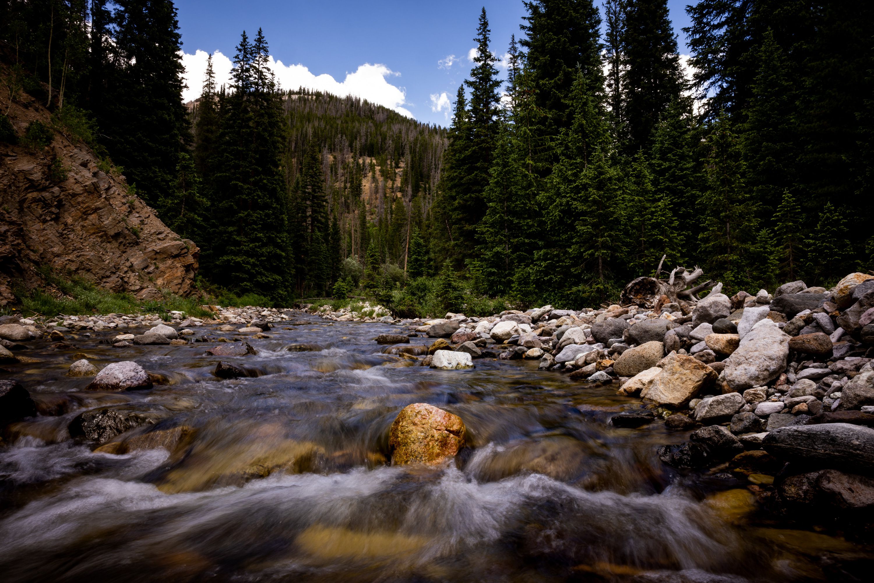 The Colorado River flows a few miles from its headwater in Rocky Mountain Park in Colorado on July 14, 2022. President Joe Biden says he has a plan with new money aimed at conservation for the river. 