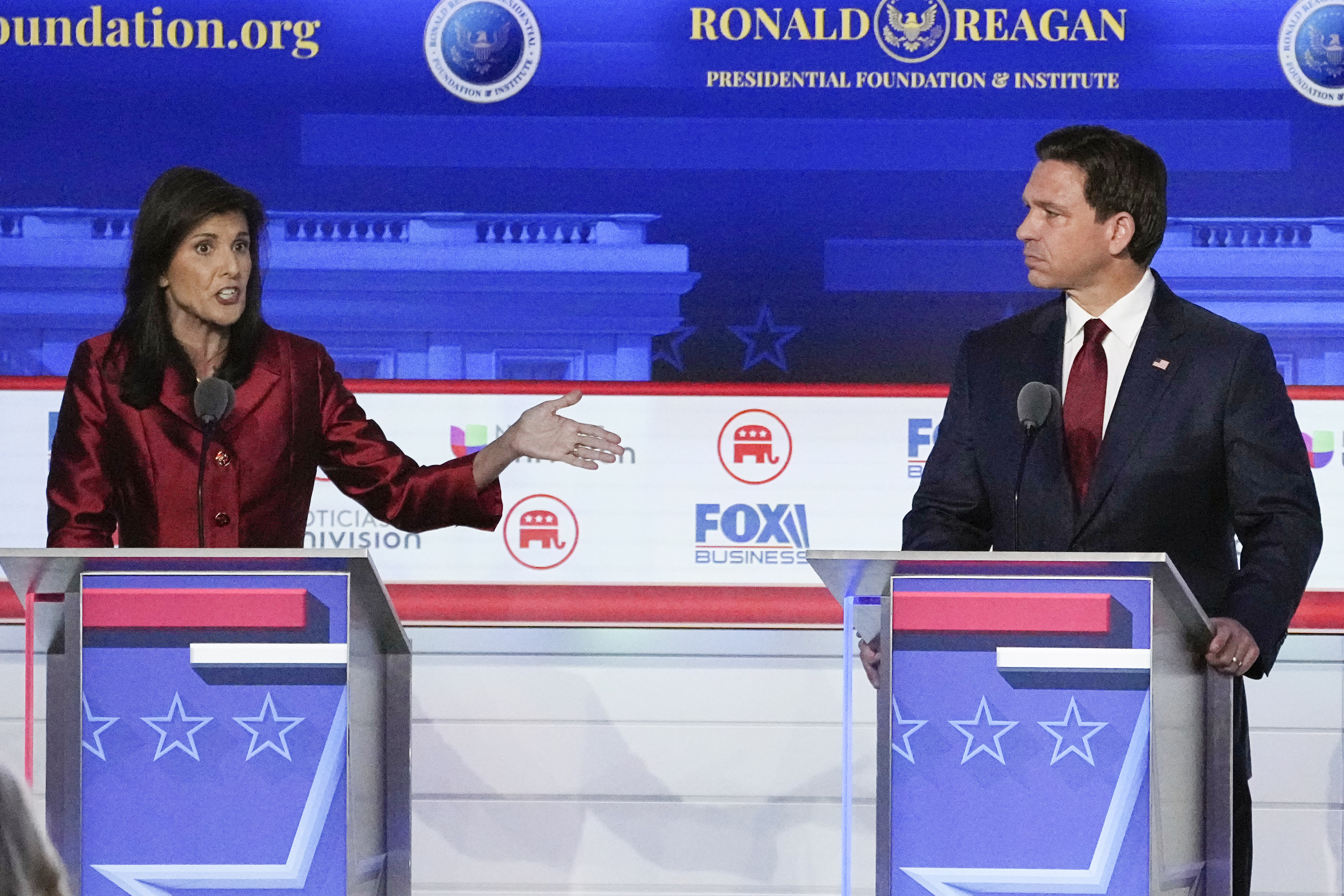 Republican presidential candidate and former U.N. Ambassador Nikki Haley, left, with Florida Gov. Ron DeSantis, speaks during a Republican presidential primary debate hosted by FOX Business Network and Univision, Sept. 27, at the Ronald Reagan Presidential Library in Simi Valley, Calif.