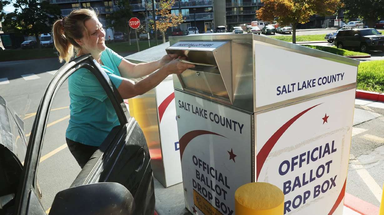 Tracy Ashcraft drops off her ballot during Utah’s municipal and primary elections at the Salt Lake County Government Center in Salt Lake City on Sept. 5. Tuesday is Election Day nationwide — but not in Utah.