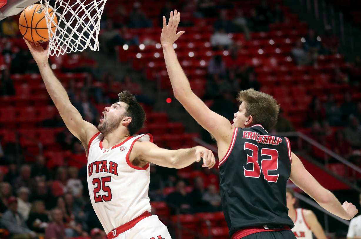 Utah Utes guard Rollie Worster (25) shoots in front of Eastern Washington Eagles forward Dane Erikstrup (32) during a men’s basketball game at the Huntsman Center in Salt Lake City on Monday, Nov. 6, 2023. Utah won 101-66.