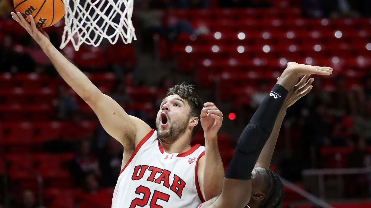 Utah Utes guard Rollie Worster (25) shoots over Eastern Washington Eagles guard Andre Mulibea (5) during a men’s basketball game at the Huntsman Center in Salt Lake City on Monday, Nov. 6, 2023.
