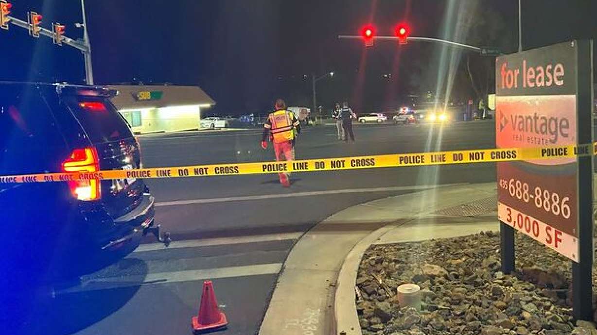 Emergency crews work the scene of a fatal pedestrian-vehicle incident Friday night at the intersection of 500 North and Bluff Street.