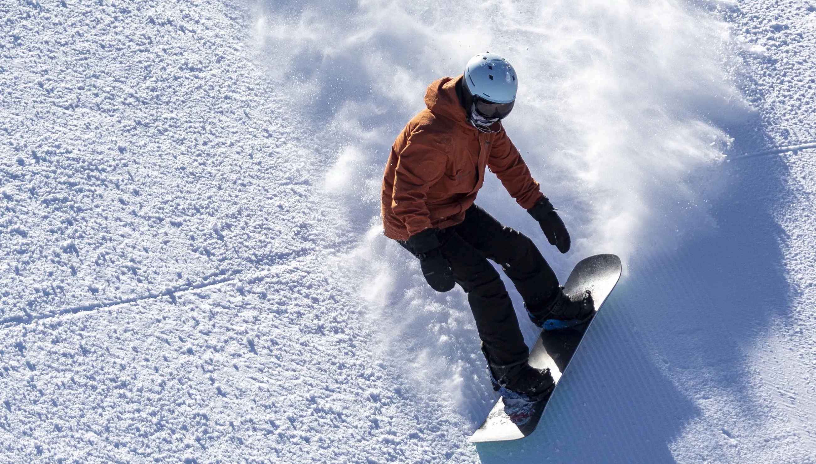 A snowboarder make their way down a run at Brighton Resort in Big Cottonwood Canyon on Nov. 14, 2022. Two states in the Northeast and three in the West were the five most "snow sports obsessed" states in the country.