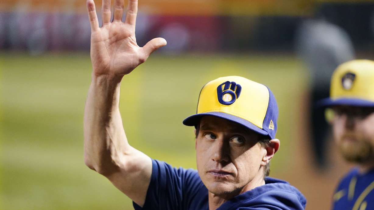 FILE -Milwaukee Brewers manager Craig Counsell waves to the crowd as he is honored as a former Arizona Diamondbacks player, during the fourth inning of the team's baseball game against the Diamondbacks on Tuesday, April 11, 2023, in Phoenix. The first sign of discontent regarding Craig Counsell’s decision to leave the Milwaukee Brewers to manage the Chicago Cubs appeared in his hometown at the Little League field that bears his name.