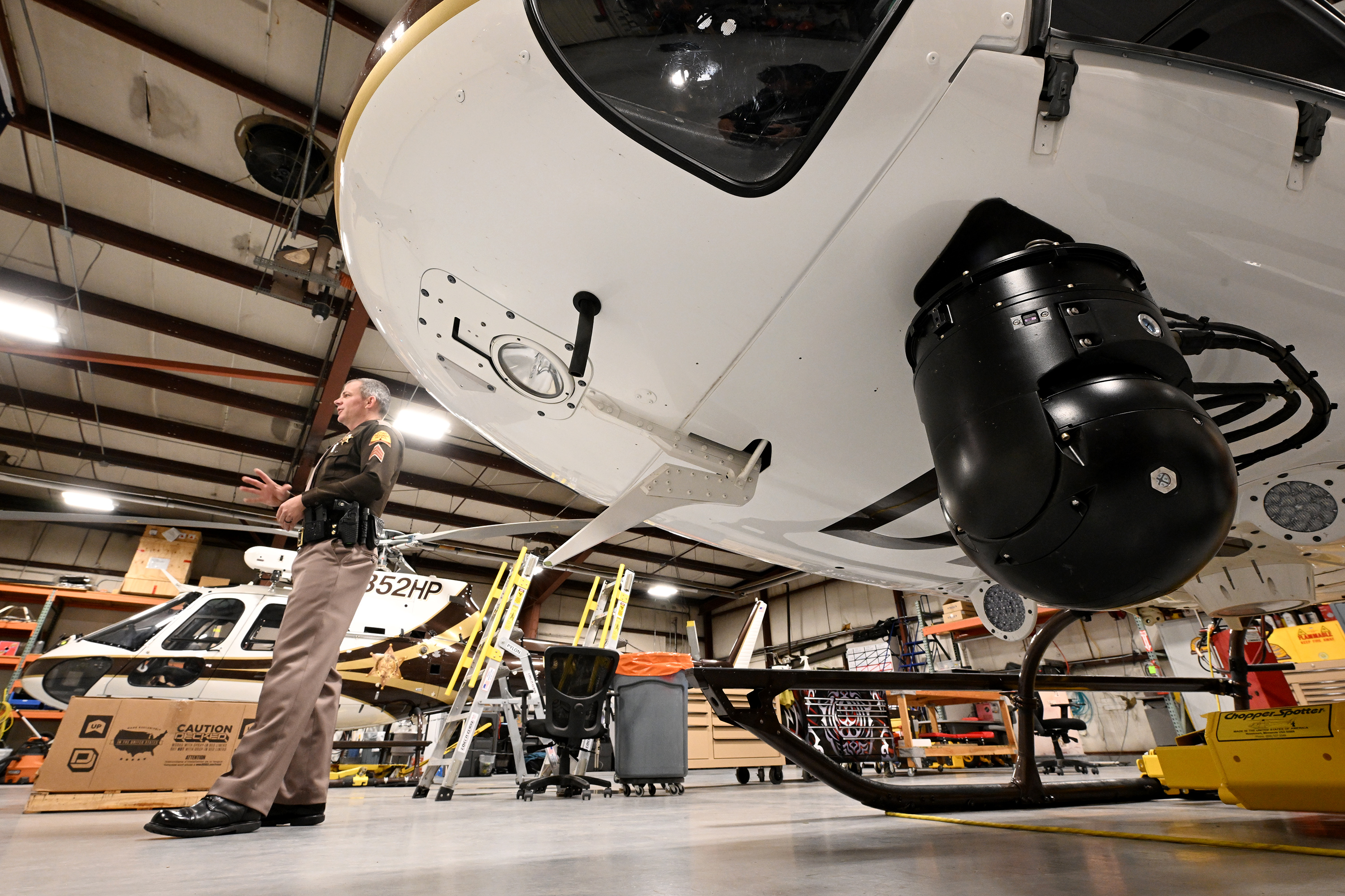 Utah Highway Patrol Sgt. Nick Napierski discusses some of the technology the UHP uses on its helicopters to apprehend suspects and assist in search and rescue calls around the state, at the UHP hangar in Salt Lake City on Tuesday.