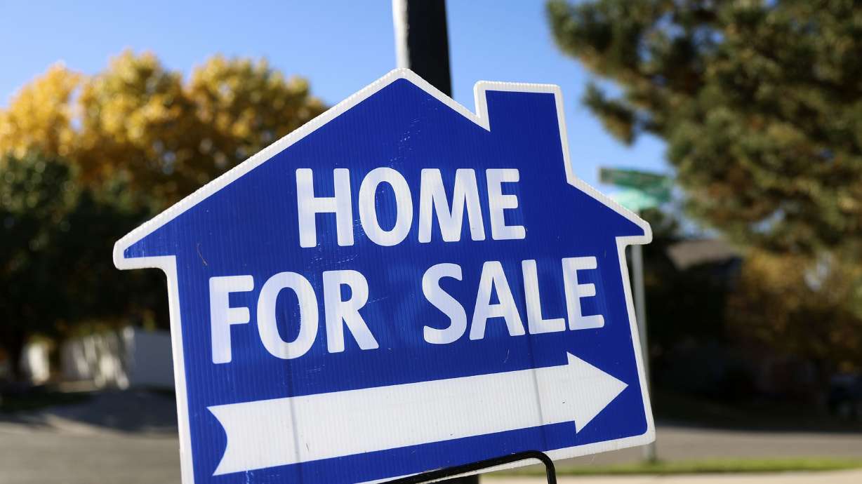 A sign is displayed for a home on the market in Draper on Oct. 18. A record number of Americans are frustrated by today’s housing market and think now is a terrible time to buy, per reports.