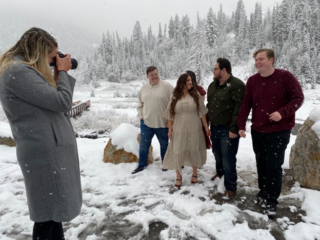 Photographer Brady Anderson takes some family portraits in the wintry conditions in Big Cottonwood Canyon Tuesday. UDOT closed Guardsman Pass early this season due to snow.