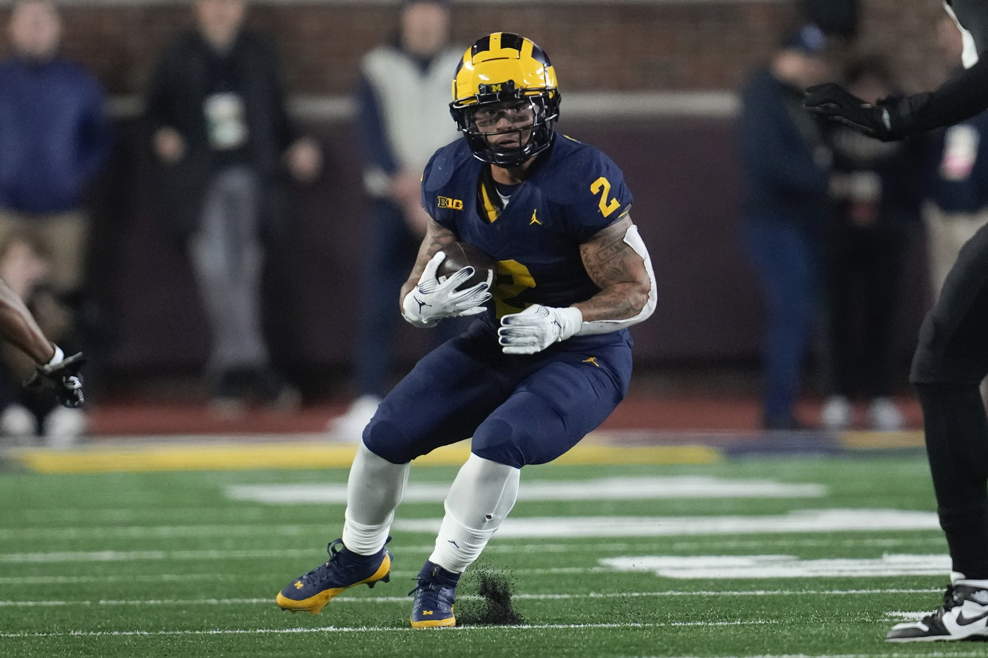 Michigan running back Blake Corum (2) runs the ball against Purdue in the first half of an NCAA college football game in Ann Arbor, Mich., Saturday, Nov. 4, 2023. 