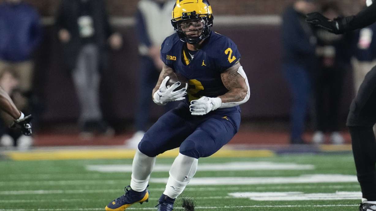 Michigan running back Blake Corum (2) runs the ball against Purdue in the first half of an NCAA college football game in Ann Arbor, Mich., Saturday, Nov. 4, 2023.