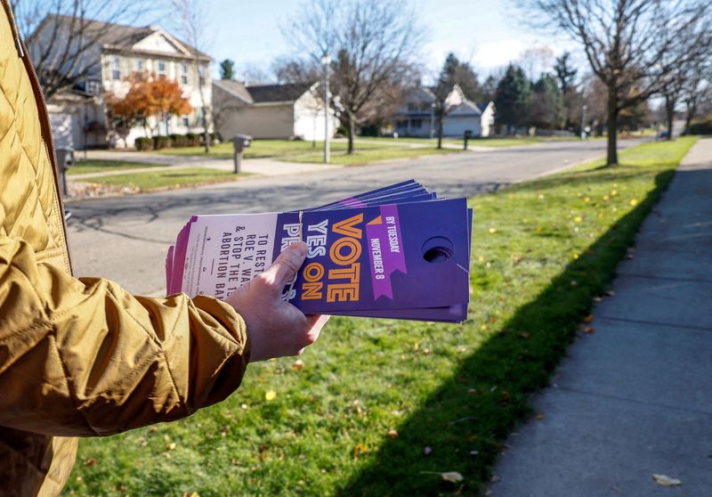 A volunteer supporting Proposal 3, a ballot measure to codify the right to an abortion in Dewitt, Michigan, November 7, 2022. Victories by abortion rights campaigners and Democrats in this week's elections pose a dilemma for Republicans.