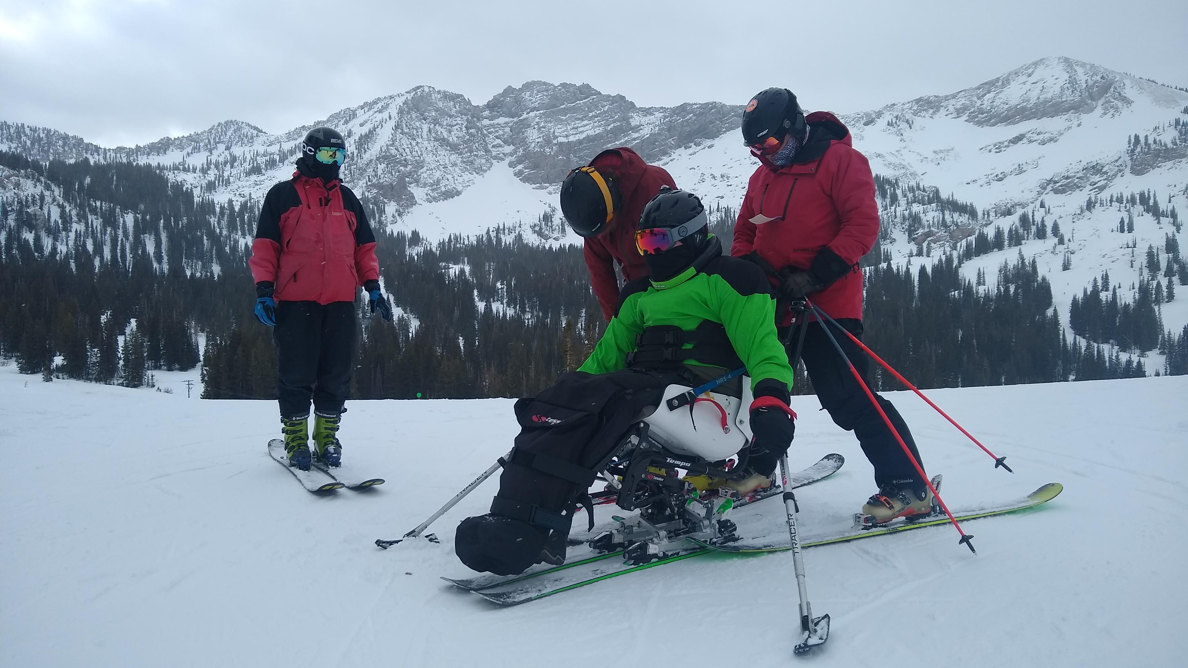 Jeff Page gets hooked up to a sit-ski before skiing down the mountain in Park City.