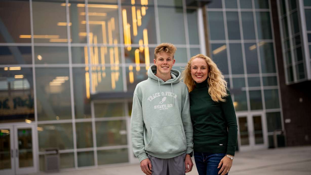 Rebecca Martin, president of the Hillcrest High School PTSA, and her son, Joshua Martin, 16, pose for a photo at the school in Midvale on Tuesday. A recent poll of parents of school-age children conducted for the Deseret News and the Hinckley Institute of Politics largely indicated satisfaction with their neighborhood schools.