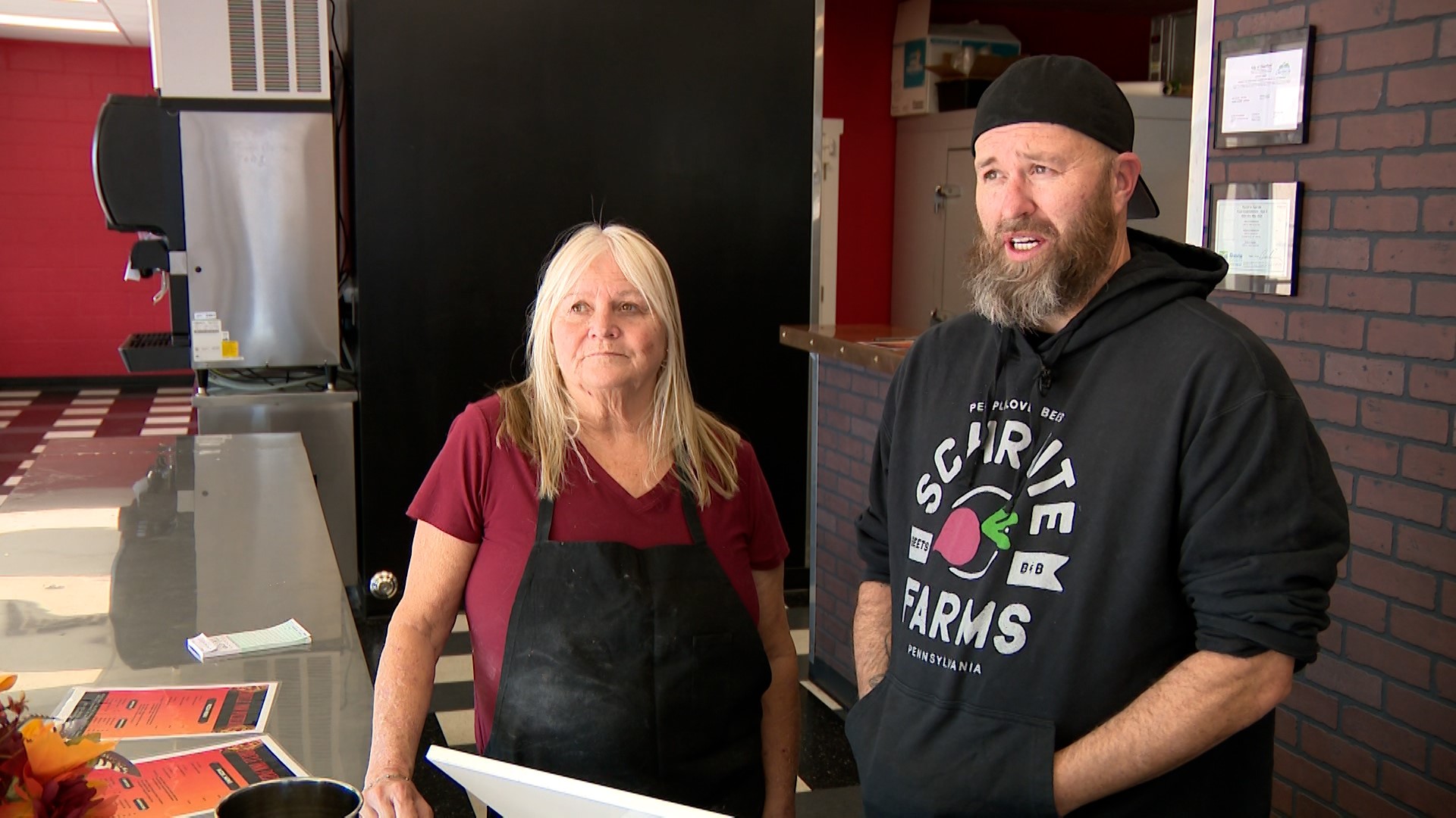 Garrett, right, and Chantil, left, Shchroeder at their new pizzeria Wednesday in Clearfield. The previous business burned down in 2022.
