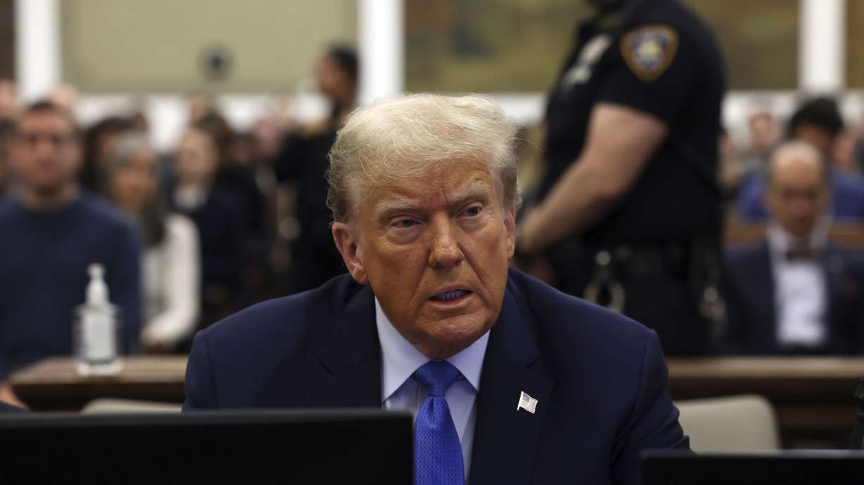 Former President Donald Trump waits during his civil fraud trial at New York Supreme Court, Monday, in New York. A judge heard arguments on whether Secretary of State Jocelyn Benson has the authority to keep Trump's name off ballots.
