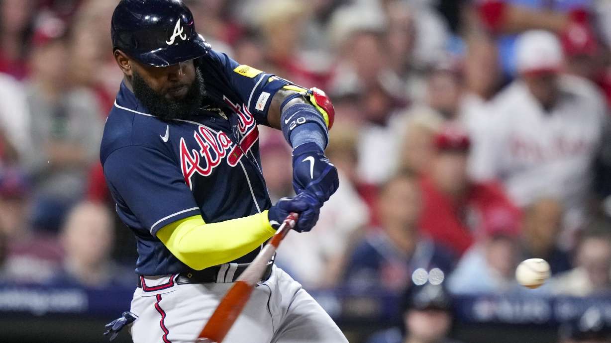 Atlanta Braves' Marcell Ozuna hitrs a single during the sixth inning of Game 3 of a baseball NL Division Series against the Philadelphia Phillies Wednesday, Oct. 11, 2023, in Philadelphia.