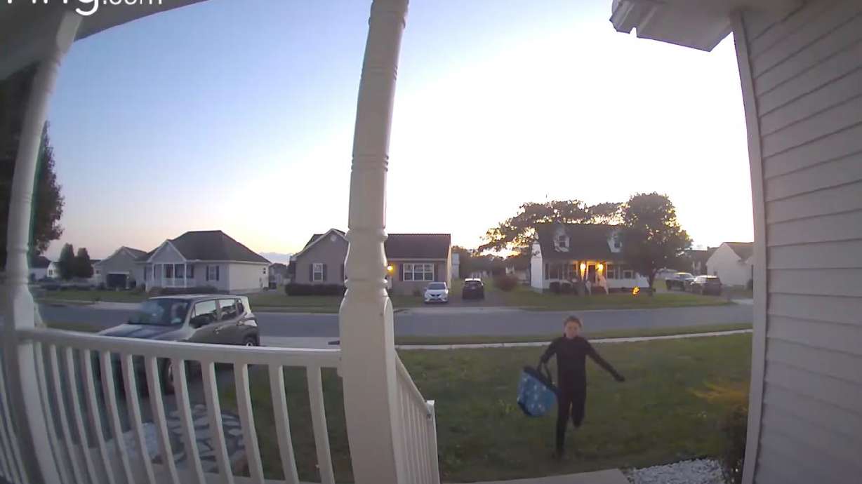 A trick-or-treater approaches a Pocomoke City, Maryland, home on Oct. 31.