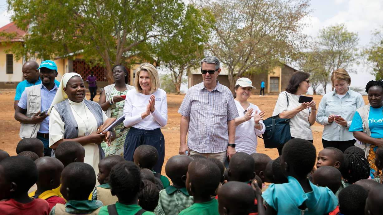 Relief Society President Camille N. Johnson and Elder Ian S. Ardern of the Africa Central area presidency meet children in a drought-stricken area of Uganda, in March 2023. The church announced a worldwide nutrition initiative on Thursday.