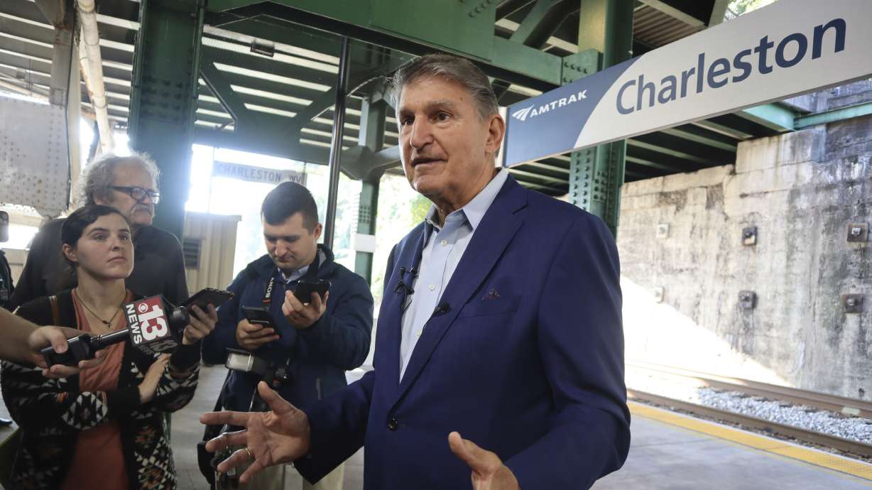 West Virginia Democratic Sen. Joe Manchin speaks with reporters outside the newly renovated Amtrak train station in Charleston, W.Va. on Oct. 12. Manchin says he won't seek reelection in 2024, giving Republicans a prime opportunity to gain a seat in the heavily GOP state.