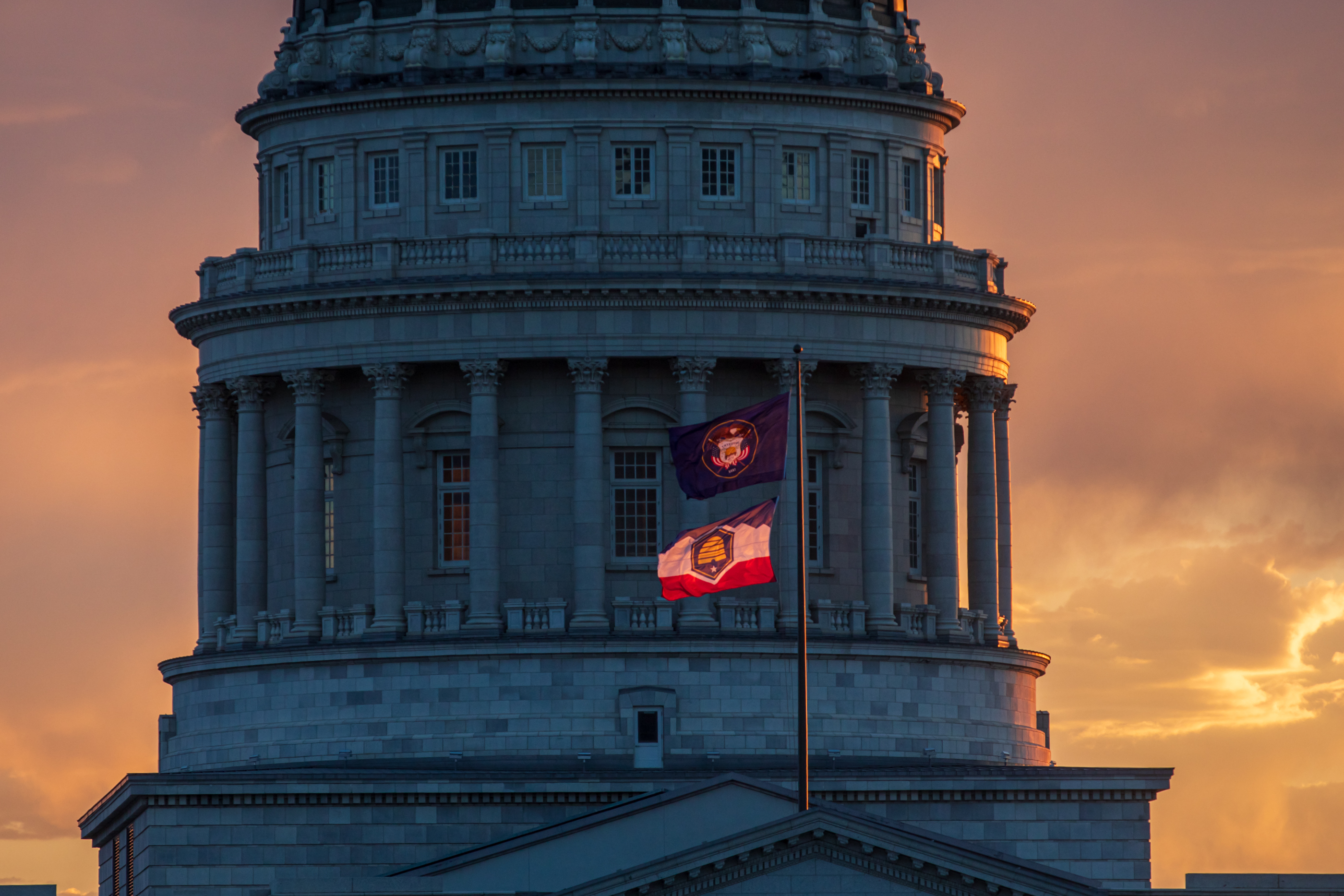 Utah's soon-to-be historical and state flags fly at the Utah Capitol on July 9, 2023. Utah election leaders filed a motion Friday asking a judge to deny a motion tied to a group seeking a state flags initiative.