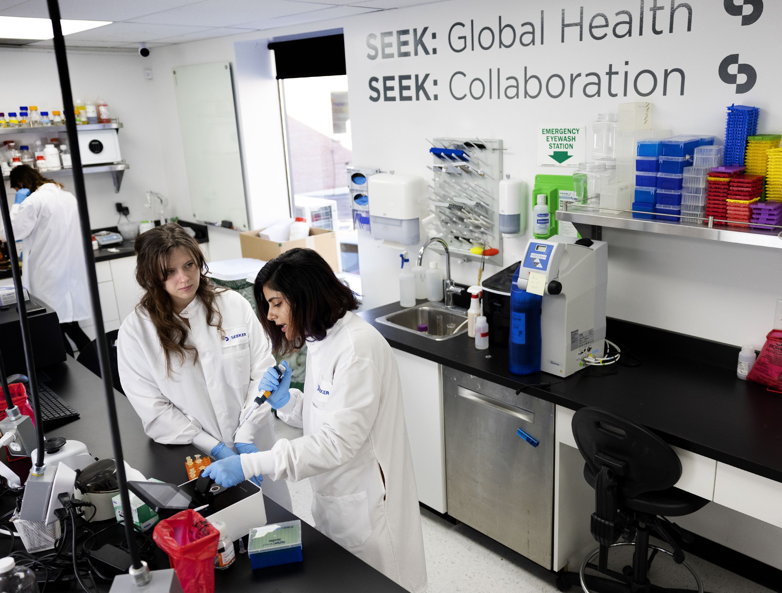 Research scientist Madi Pyper and Dr. Ashvini Ray, right, measure concentrations of DNA with the use of a NanoPhotometer at Seek Labs in Salt Lake City on Thursday.