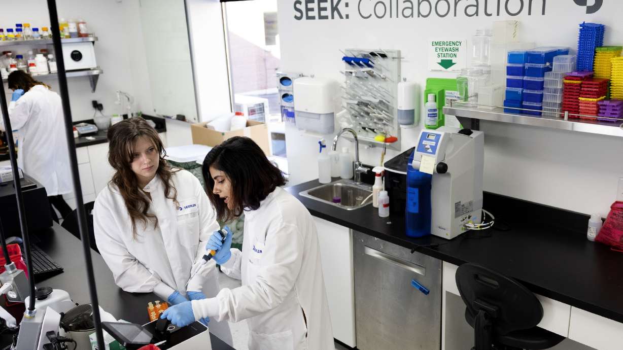 Research scientist Madi Pyper and Dr. Ashvini Ray, right, measure concentrations of DNA with the use of a NanoPhotometer at Seek Labs in Salt Lake City on Thursday.