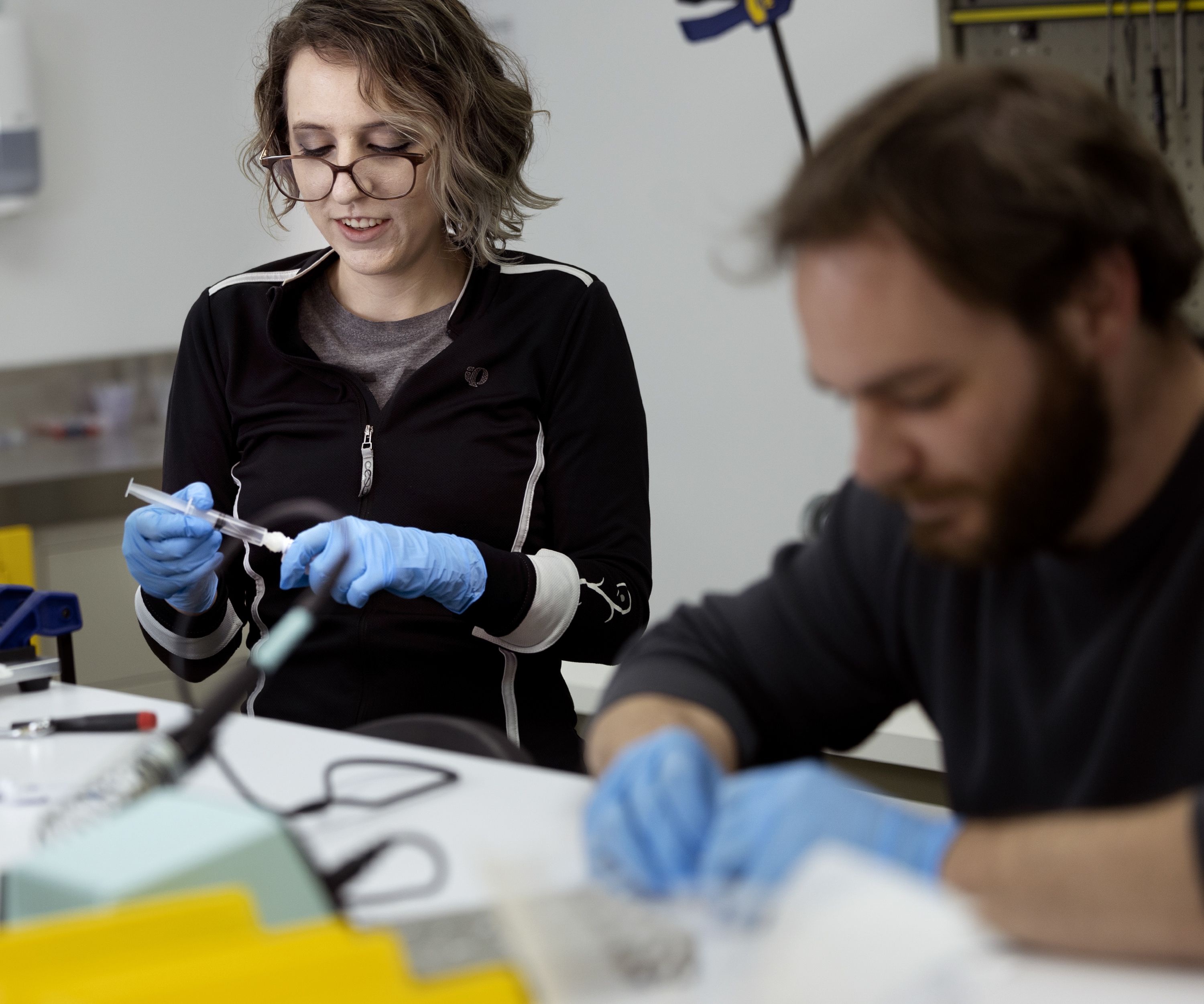Research assistants Alyssa Sam, left, and Kyle Spivack build SeekIt DNA extraction devices at Seek Labs in Salt Lake City on Thursday.