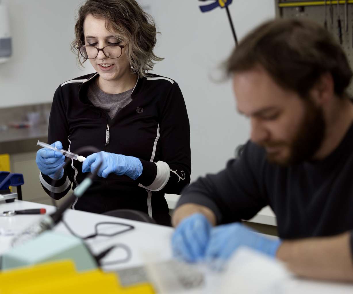 Research assistants Alyssa Sam, left, and Kyle Spivack build SeekIt DNA extraction devices at Seek Labs in Salt Lake City on Thursday.