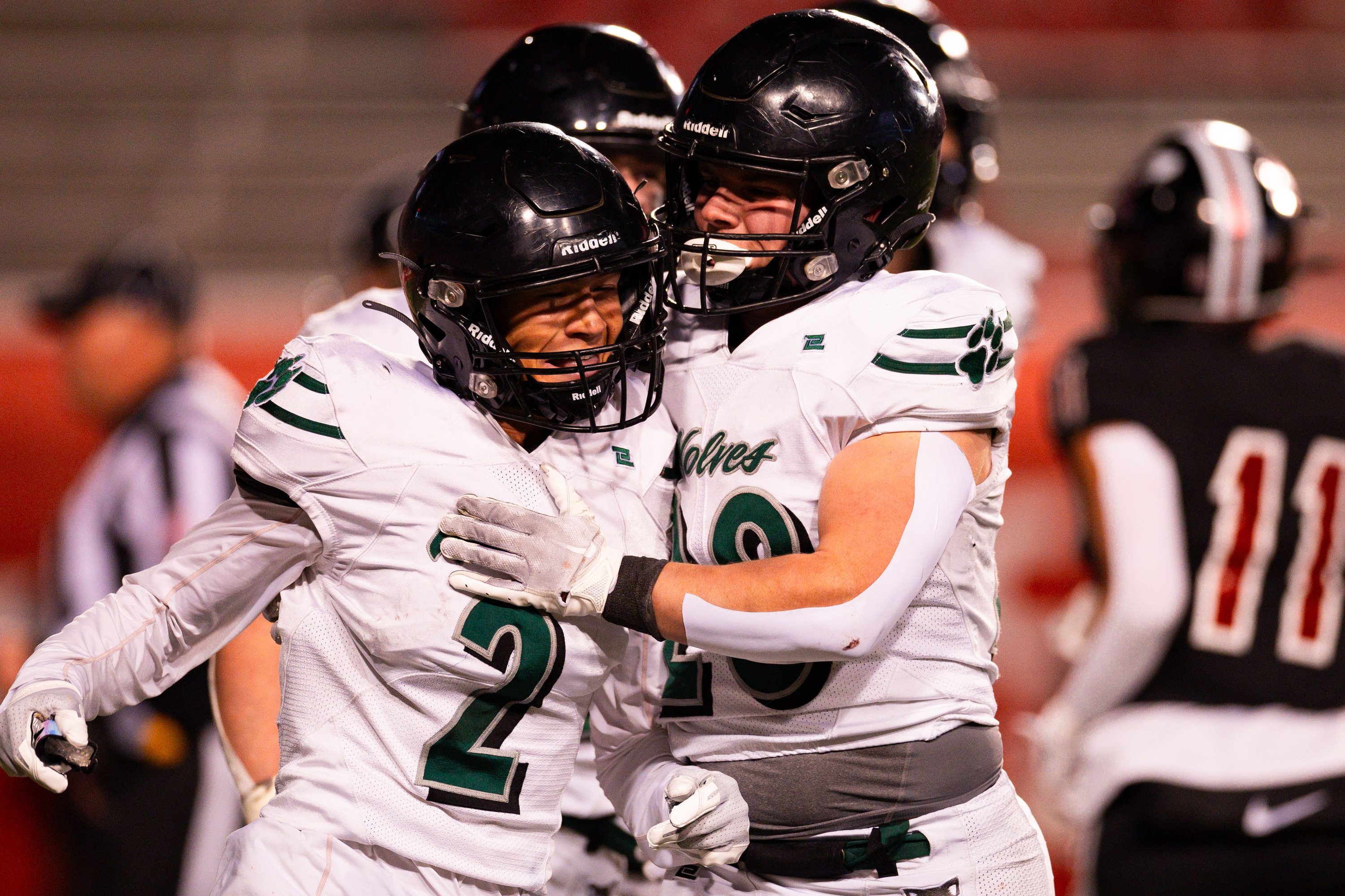 Green Canyon High School’s Eric Oates, right, celebrates with teammate Dewey Egan after Egan’s touchdown during the 4A football state semifinal game against Park City High School at Rice-Eccles Stadium in Salt Lake City on Thursday, Nov. 9, 2023.