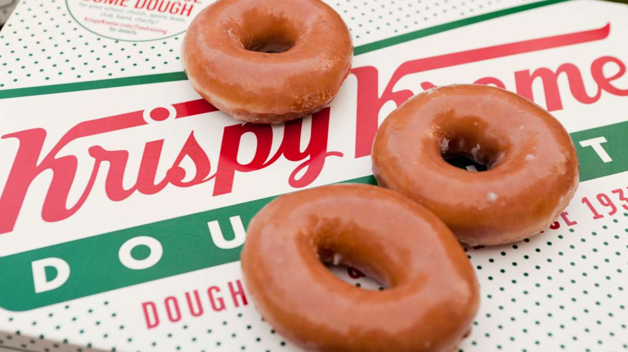 Krispy Kreme is celebrating "World Kindness Day" on Monday by giving out a box of a dozen glazed donuts for free with no purchase necessary. There is a catch, though.