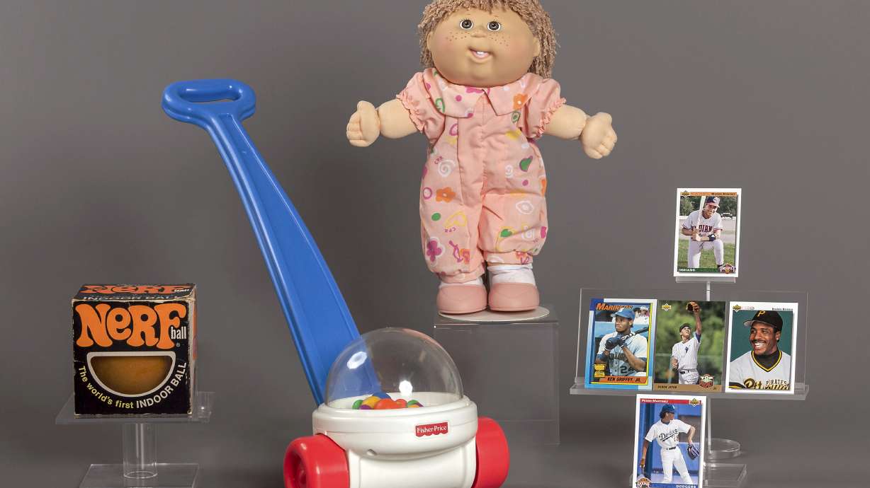 This photo provided by the National Toy Hall of Fame shows their 2023 inductees. From left, NERF, Fisher-Price Corn Popper, Cabbage Patch Kids, and baseball cards. They will be permanently installed at the Toy Hall of Fame in Rochester, NY.