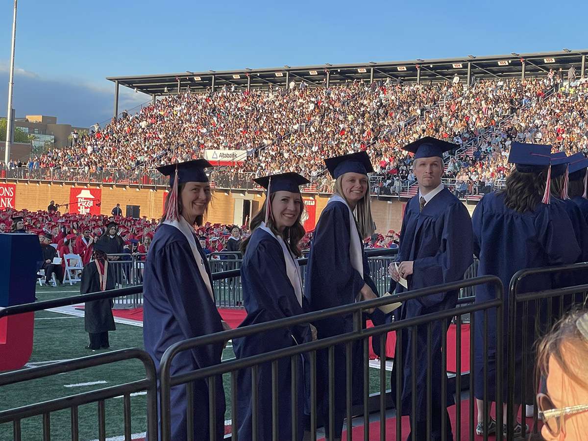 2023 graduates just before receiving their hoods: Jenny Chamberlain, Adell Kirkman, Madi Wawrzniak, and Jesse Cowley.