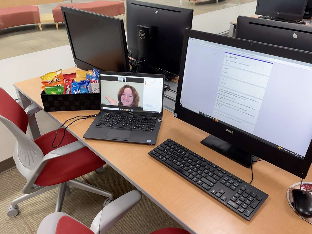 Remote student Emma Walker welcoming participants to a usability study, orienting them to the intake form and offering them a snack, all from 300 miles away.