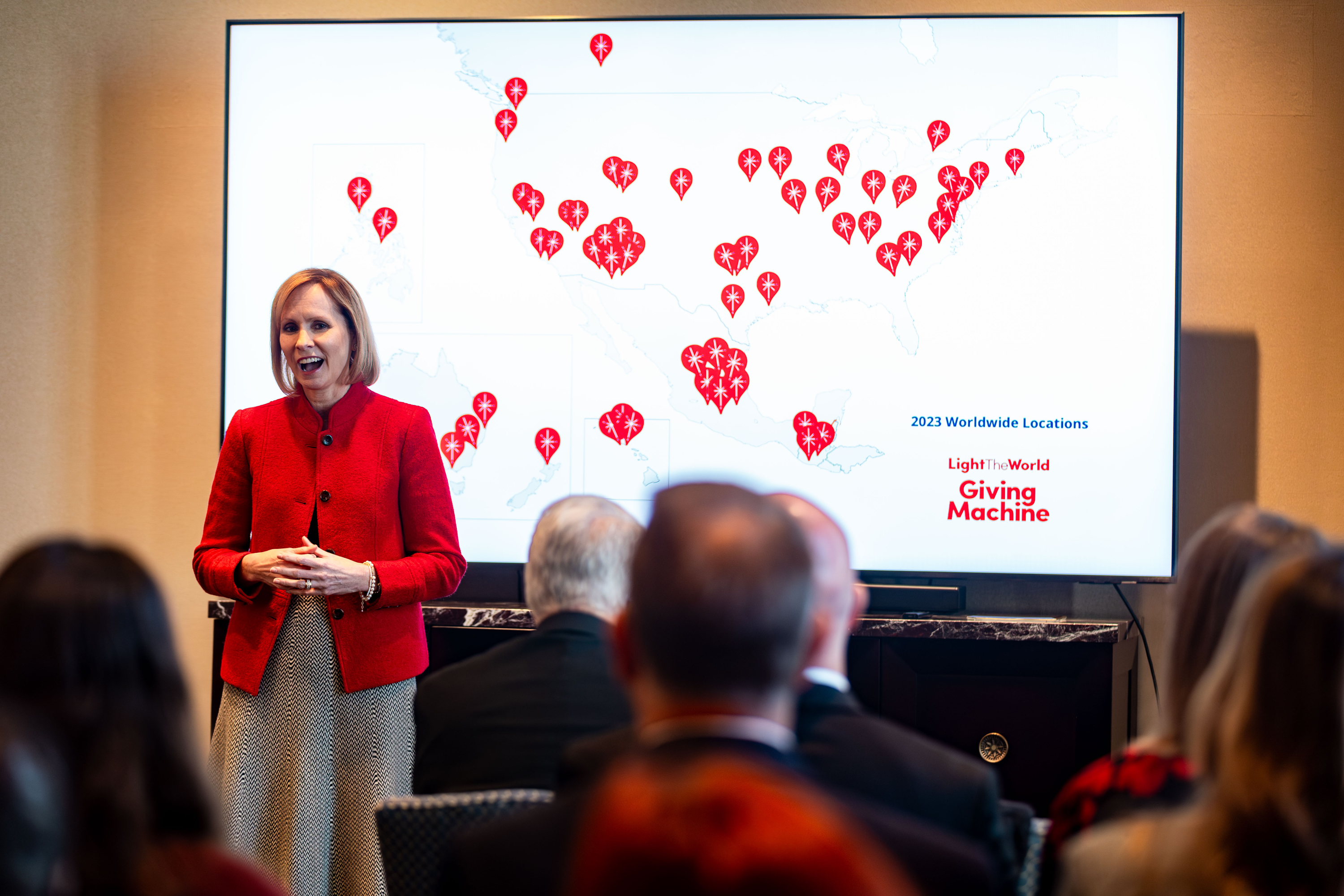 Sister Amy A. Wright, first counselor in the Primary general presidency, speaks about the giving machines that are part of the annual Light the World initiative led by The Church of Jesus Christ of Latter-day Saints at the Conference Center on Friday.