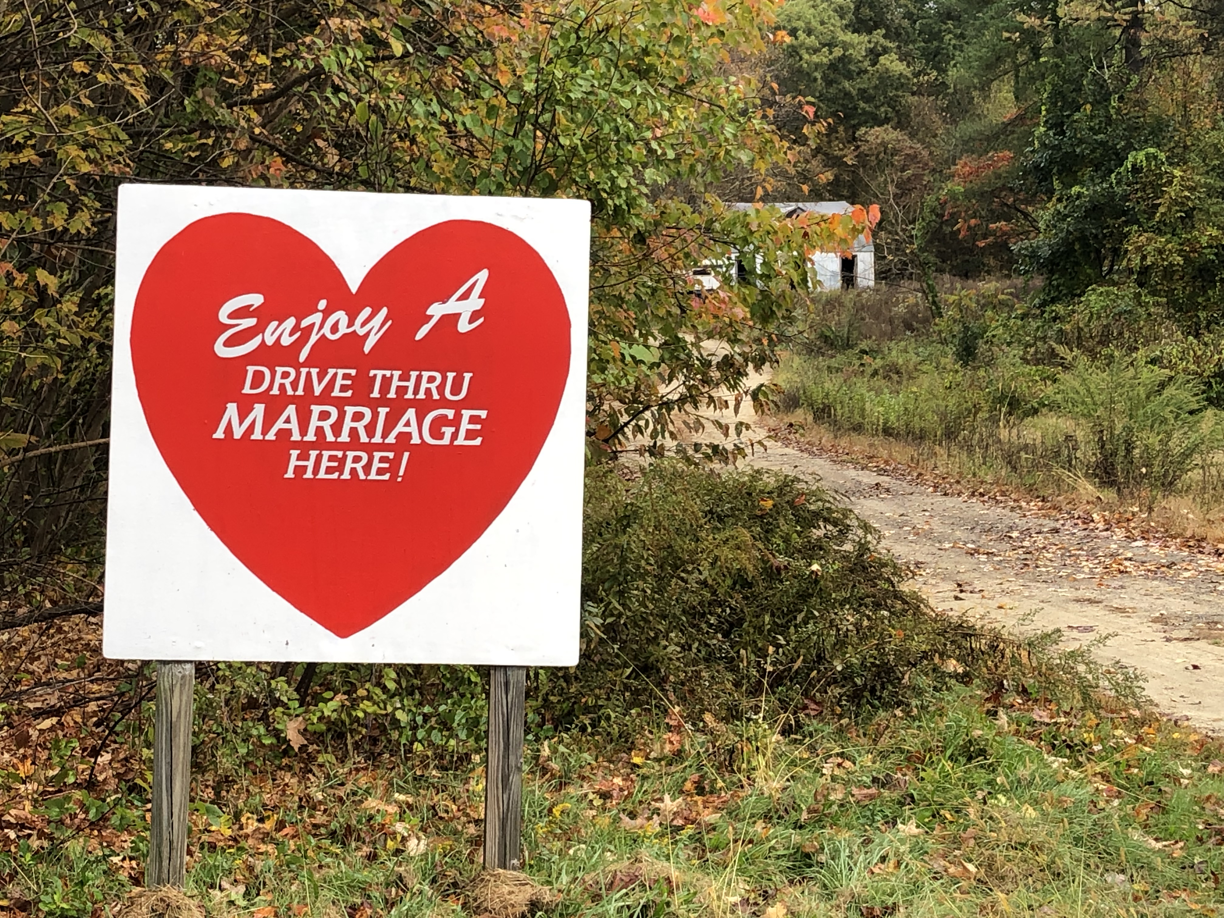 A sign in western Massachusetts advertises drive-through weddings at a home of a justice of the peace.